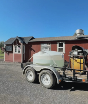Gem State Pressure Washing equipment trailer with water tank